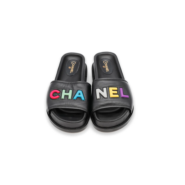 Chanel Slippers – Black with Multicolour Logo

€59..