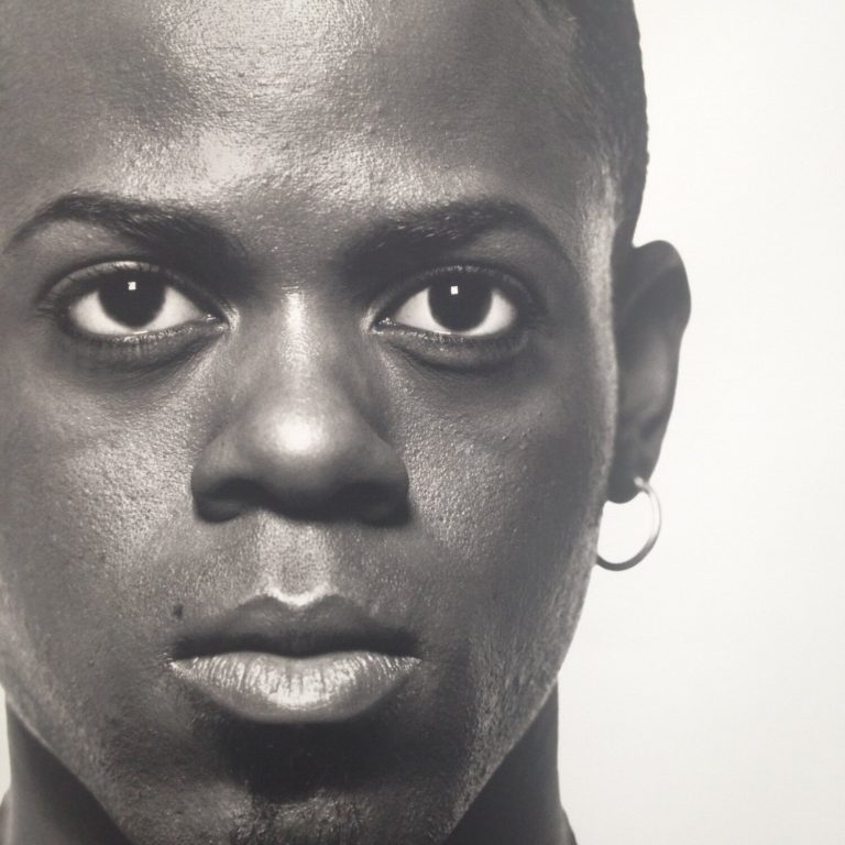 MICHEL COMTE

“Black man – hoop earrings – full fa..