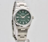 ROLEX OYSTER PERPETUAL 31MM GREEN DIAL – UNWORN
Re..
