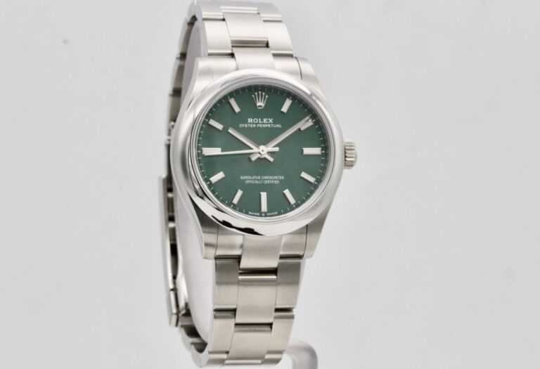 ROLEX OYSTER PERPETUAL 31MM GREEN DIAL – UNWORN
Re..